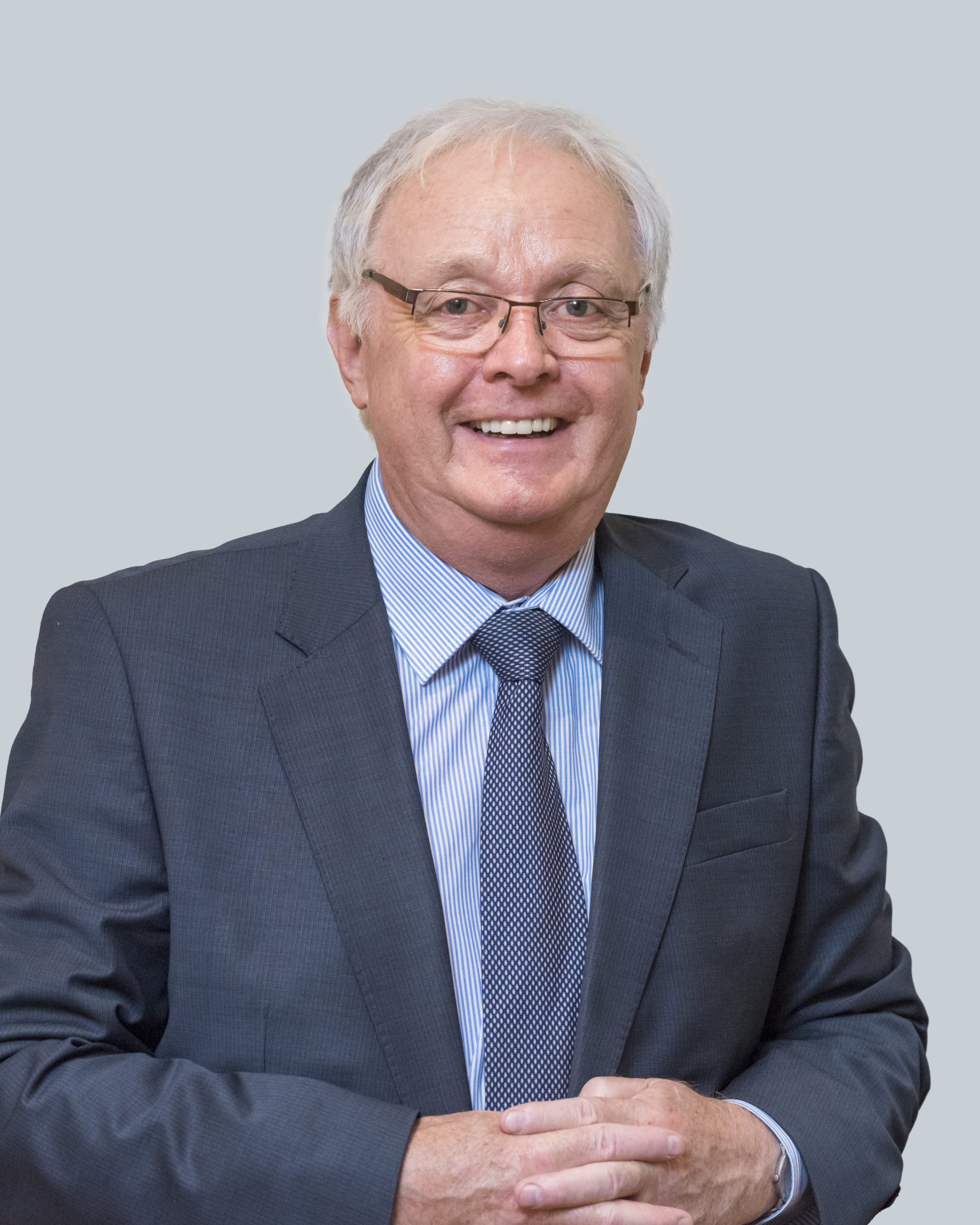 Professional headshot of John Higgins, Executive Retirement Planning Coach & Facilitator, helping senior professionals plan purposeful and well-structured transitions into retirement.